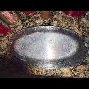 Old silver tray with designs on it